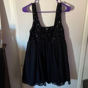 Cute little black dress /blouse with sequins.